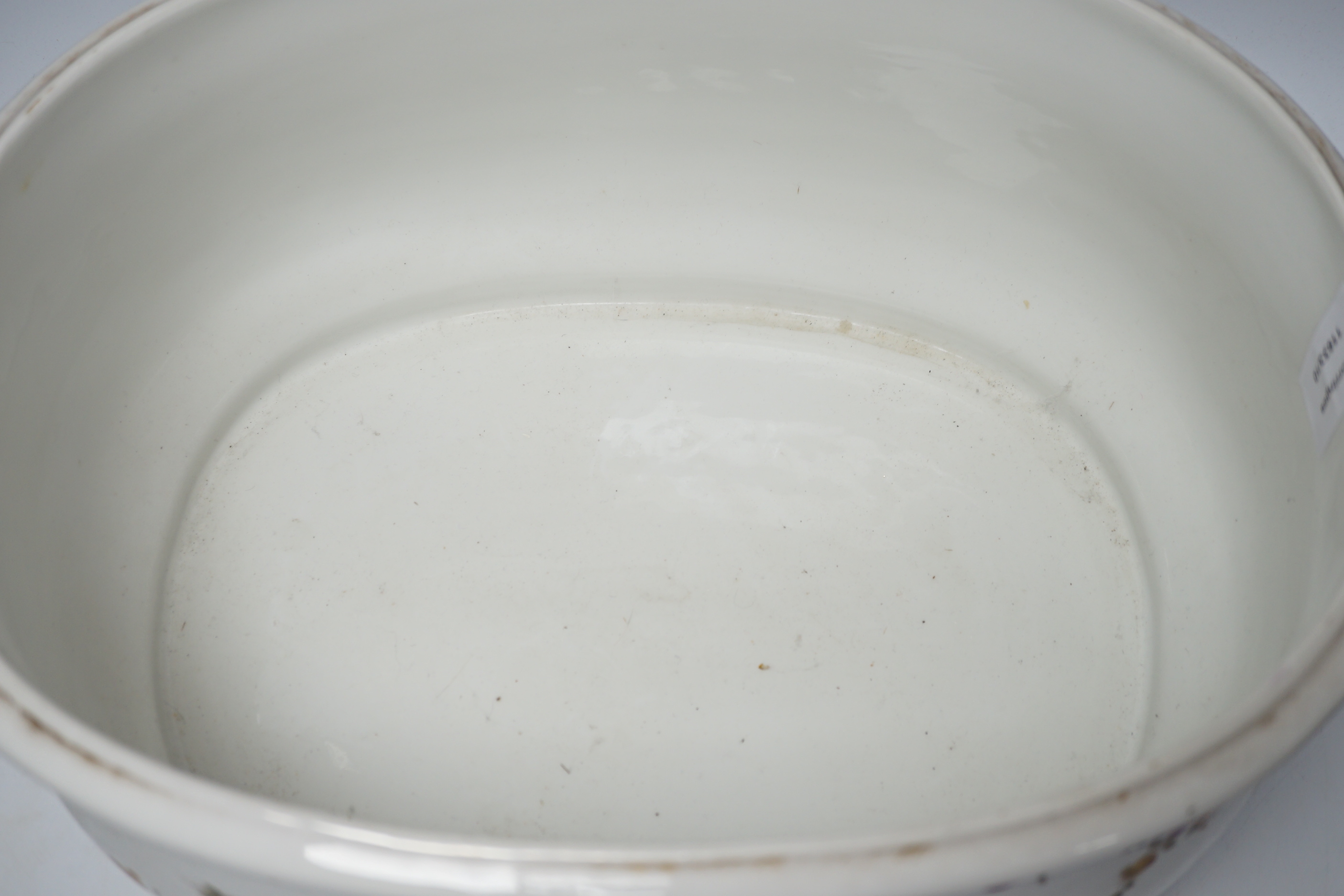 An Edwardian porcelain floral and gilt decorated foot bath, top 40cm wide not including handles